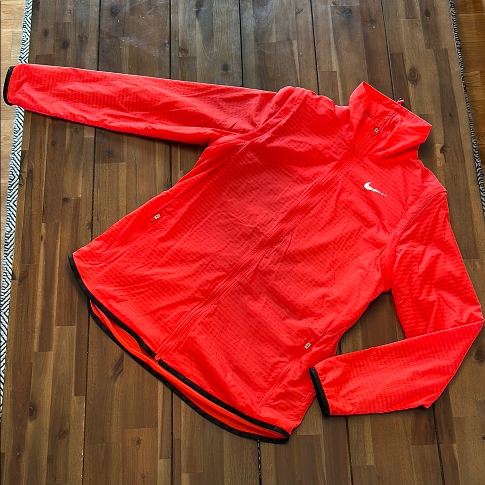 Nike Brand Coral Red Striped Lightweight Jacket with Black Trim.